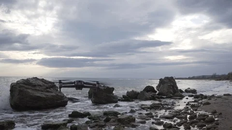 Drone flies in the wavy sea in cloudy weather Stock Footage 125314149