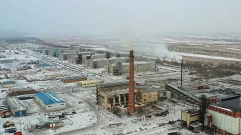 The drone flies in the winter over the poultry farm plant. 4K Stock Footage 236451660