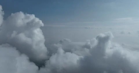 Drone flight above clouds during a misty sunrise morning Stock Footage 256224416