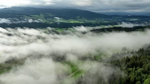 Drone flight above clouds over the Bregenz Forest Stock Footage 299352206