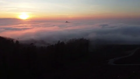 Drone flight above the clouds at sunset in Galicia Stock Footage 122463808