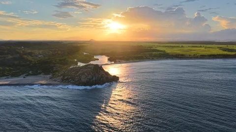 Drone Flight Above Elephant Rock at Sunset on Sri Lanka Coast Stock Footage 339310974