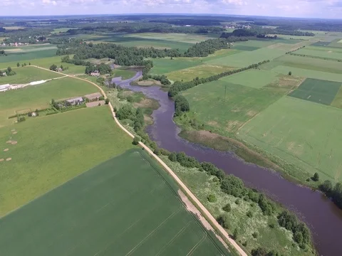 Drone flight above the fields and river Stock Footage 85088066
