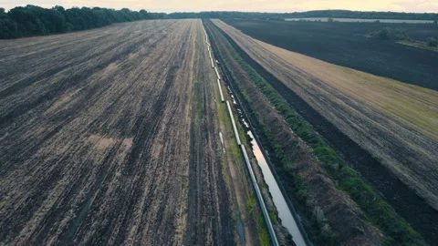 Drone flight Above Gas and Oil Pipeline. Pipes welded together, are laid on top Stock Footage 195216237
