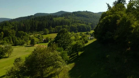 Drone Flight Above Green Field, Village on the Hills / Black Forest  Vídeo Stock 129337451