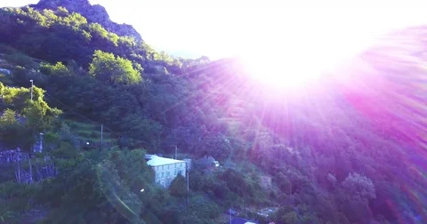 A drone flight above a green mountain in italy Stock Footage 78377840