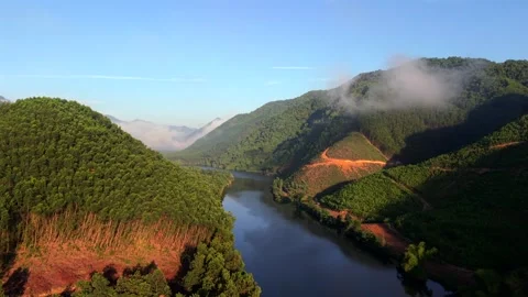 Drone Flight Above Green Mountains and Blue River Stock Footage 336857177