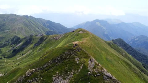 Drone flight above isolated mountain valley Video stock 322806894