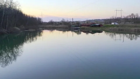 Drone flight above lake surface in sunset Stock Footage 261960847