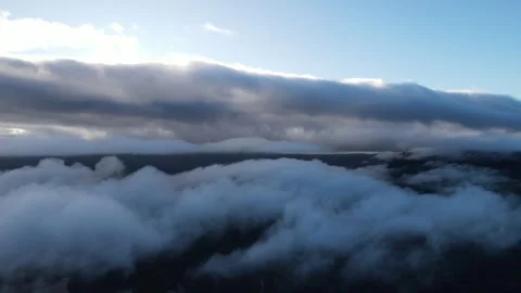Drone Flight Above Low Clouds with Sunlight Breaking Through Higher Clouds Vidéo 343720023