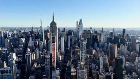 Drone flight above the Manhattan downtown from above at sunrise with no clouds. Stock Footage 299467359