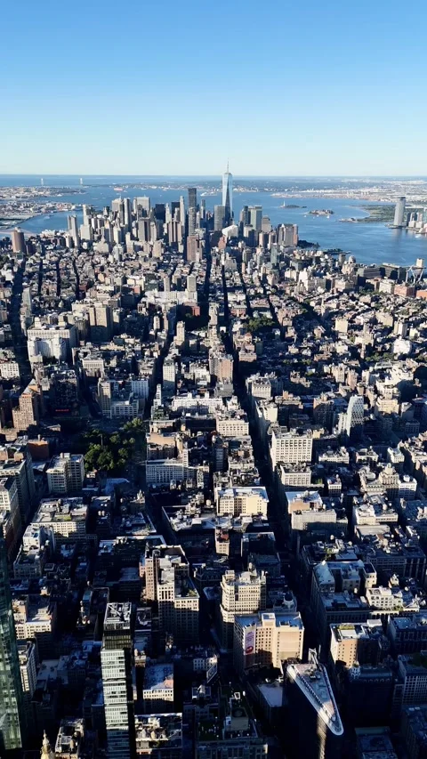 Drone flight above the Manhattan downtown from above at sunrise with no clouds. Stock Footage 305033575