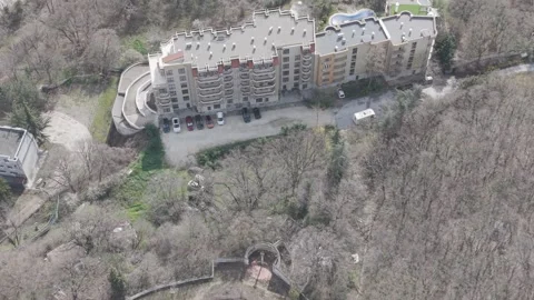 Drone Flight Above Modern Housing Complex Near Forested Hills And Roads Stock Footage 332773622