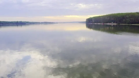 Drone flight above river Danube in a sunset near Beocin, Serbia Stock Footage 258957193