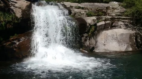 Drone flight above the river on the Melon Waterfall in Galicia Stock Footage 123217372