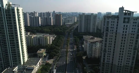 Drone flight above the road through residental district Video stock 251871933