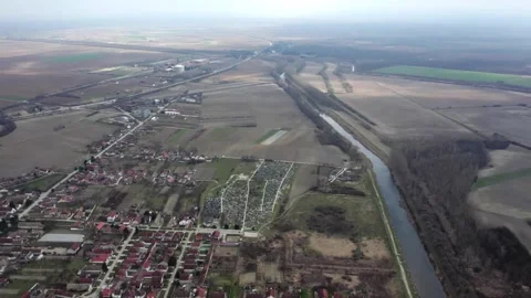 Drone flight above small town Bac, Serbia in cloudy day Stock Footage 258609547