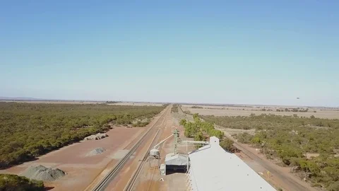 Drone flight above train track and grain silo outback Australia Stock Footage 76111372