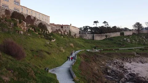 Drone flight above the walking path of the Castle in Baiona, Galicia Stock Footage 122467358