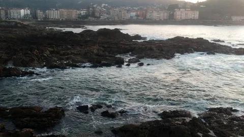 Drone flight above the waves clashing on the rocks in Baiona, Galicia, Spain Stock Footage 122466833