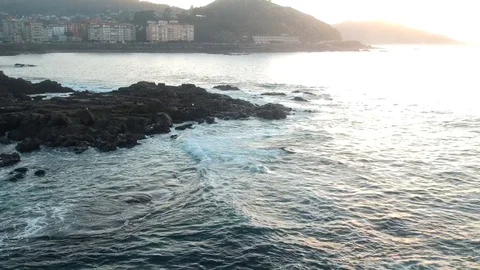Drone flight above the waves clashing on the rocks in Baiona, Galicia, Spain Stock Footage 122466909