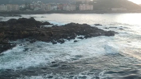 Drone flight above the waves clashing on the rocks in Baiona, Galicia, Spain Stock Footage 122466950
