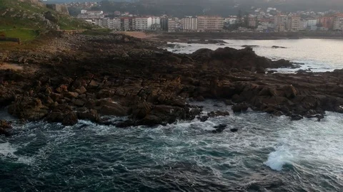 Drone flight above the waves clashing on the rocks in Baiona, Galicia, Spain Stock Footage 122466990
