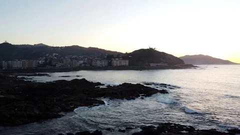 Drone flight above the waves clashing on the rocks in Baiona, Galicia, Spain Stock Footage 122467480