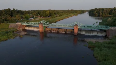 Drone Flight Above Weir during golden hour Stock Footage 311309931