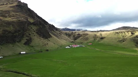 Drone flight across green valley near Skogafoss Iceland 4K 스톡 동영상 343869144