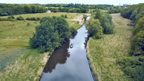 DRONE FLIGHT ACROSS SMALL RIVER IN THE FOREST Stock Footage