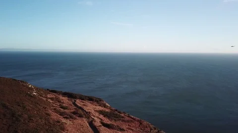 Drone Flight Aerial UAV Howth towards Helicopter Stock Footage 92007678