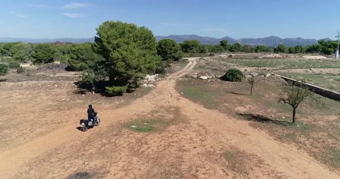 Drone flight after a large displacement motorcycle trail with suitcases Stock Footage 124365028