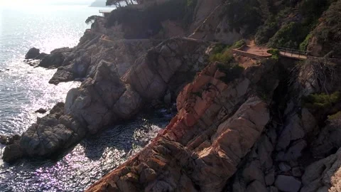Drone Flight Along Backlit Rocky Coast, Sunrise or Sunset, Costa Brava, Spain Stock Footage 306016194
