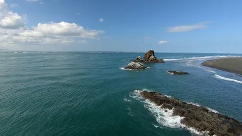 Drone flight along beach and rocky coast in New Zealand Stock Footage 82945692