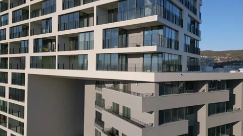 Drone flight along the facade of a modern office or residential building Stock Footage 257074786