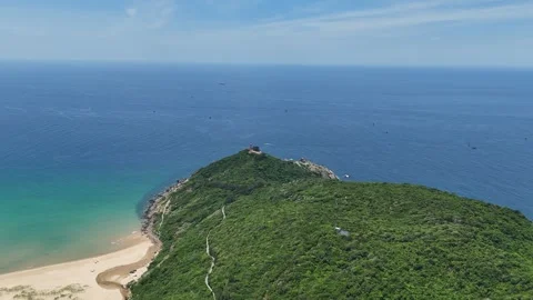 Drone flight along hillside toward Bai Mon Beach, Dak Lak (Phu Yen), Vietnam Stock Footage 339406334