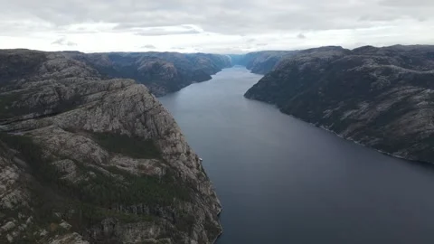 Drone Flight Along Massive Rocky Cliffs of Lysefjord Stock Footage 336007497