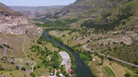 Drone flight along a narrow mountain river in Georgia Video stock 168678119