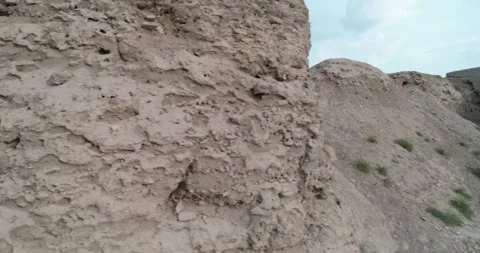Drone flight along the old ancient walls of the Ark fortress in Bukhara Stock Footage 243009139