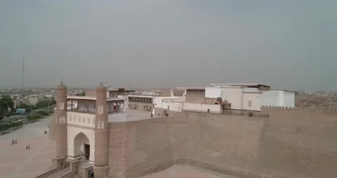 Drone flight along the old ancient walls of the Ark fortress in Bukhara Stock Footage 243009273