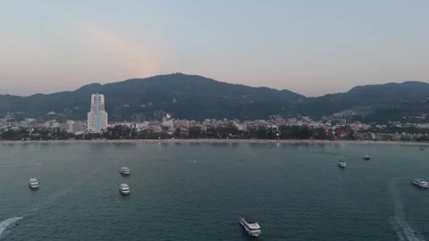 Drone flight along Patong Beach shoreline and turquoise water Vídeos de archivo 333414550