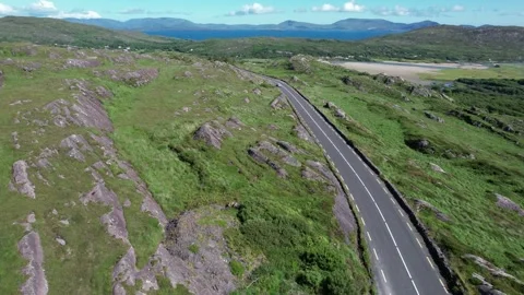 Drone flight along the Ring of Kerry mountain road above Derrynane Stock Footage 346746231