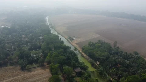 Drone Flight Along River Showing Rural Life and Farmland Near the Sundarbans Video stock 327640790