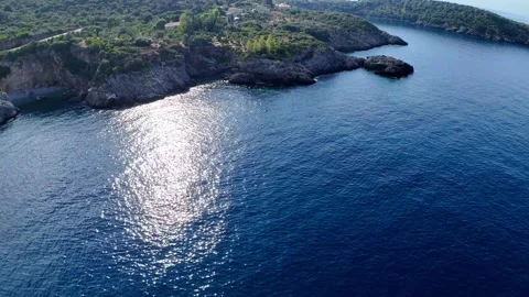 Drone Flight Along Rocky Coast and Sea Cave in Greece Stock Footage 336840095