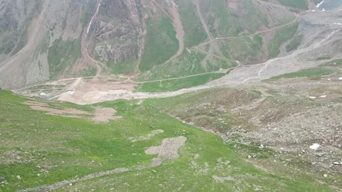 Drone flight along rugged snowy mountain ridge in Kazakhstan Stock Footage 340448933