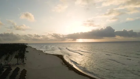 Drone flight along a sunlit tropical shoreline Stock Footage 345681528