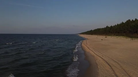 Drone flight along the waterfront at sunset Stock Footage 314798044