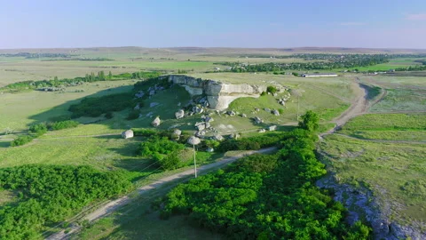 Drone flight along the white cliff at dawn at the foot of a country road and Video stock 152401779