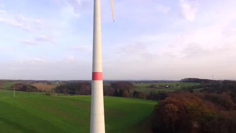 Drone flight along a wind turbine Stock Footage